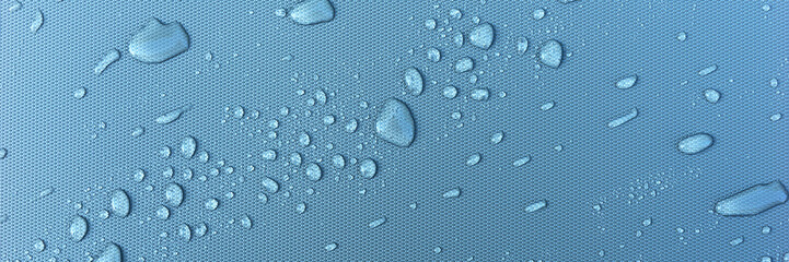 Panoramic image. Many water drops on blue background