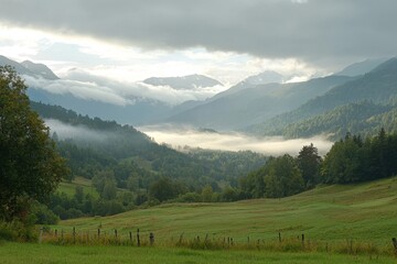 Serenity in the mountains as mist envelops lush valleys and rolling hills at dawn