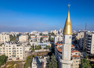 Gold-clad minaret at a mosque in downtown Ramallah, the capital of the Palestinian Territories in...
