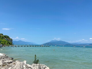A wooden pier that juts far into Lake Hardy attracts vacationers to jump into the water.