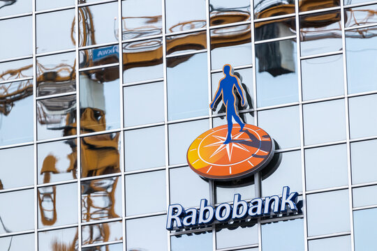 Utrecht, the Netherlands 07 January 2023. Rabobank logo on the headquarters building. Reflection of a construction crane in the mirrored windows.