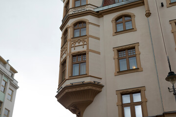 A large and spacious building that features numerous windows and also includes a stylish balcony...