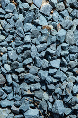 Granite chippings layer texture for road asphalting preparation, close up