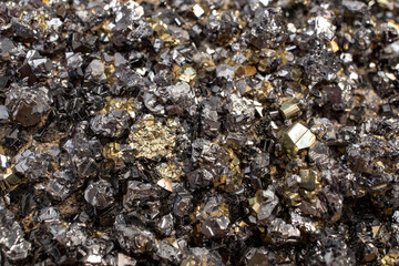 Pyrite mineral flower black and golden color soft focus close up, abstract pattern structure