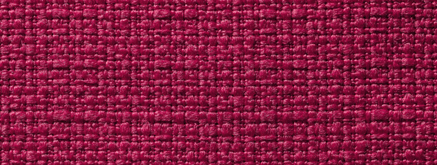 Texture dark red and wine background from woven textile with wicker pattern, macro. Structure of magenta vintage fabric