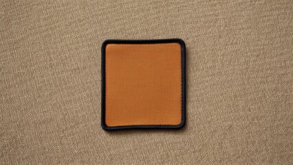 Fototapeta premium High-quality patch mockup. Ideal for showcasing leather patches, fabric designs, or branding elements for apparel or accessories.