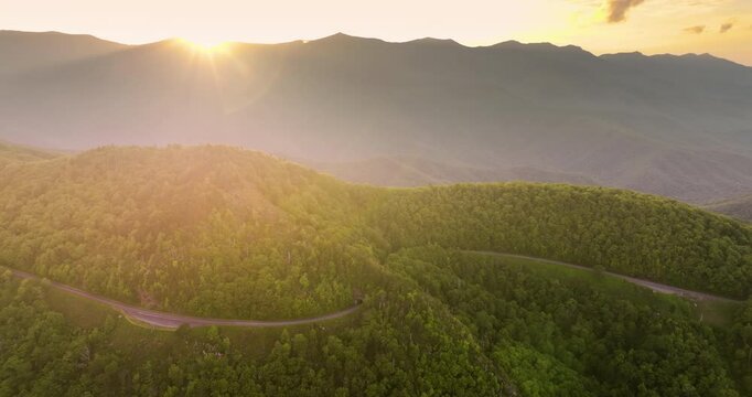 Car road trip on Blue Ridge Parkway in North Carolina Appalachian mountains. Laurel Knob Overlook and tunnel in summer season at sunset. Summertime landscape of beautiful nature