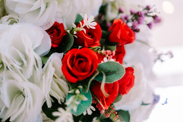 A vibrant red artificial rose,