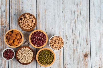 Mung beans, Red kidney beans, Chickpeas source and peeled barley in a basket wooden isolated on wood background