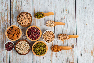 Mung beans, Red kidney beans, Chickpeas source and peeled barley in a basket wooden isolated on wood background