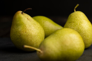 a green ripe pear on the table