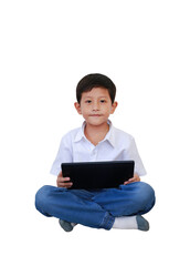 Portrait Asian little boy child playing tablet computer while sitting isolated on white background. Full body photo with clipping path.