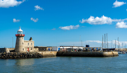 Beautiful seascape - Howth lighthouse with boat