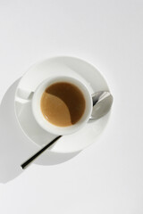Cup of Aromatic Espresso Coffee with Crema Foam on White Background. View from Above.