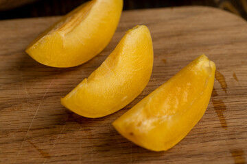 ripe soft apricot fruits on the cutting board