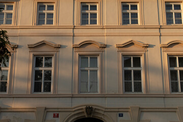 There is a large, striking white building that prominently displays the number 14 on its clear and...