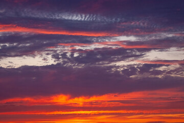 A beautiful sunset with a purple sky and clouds