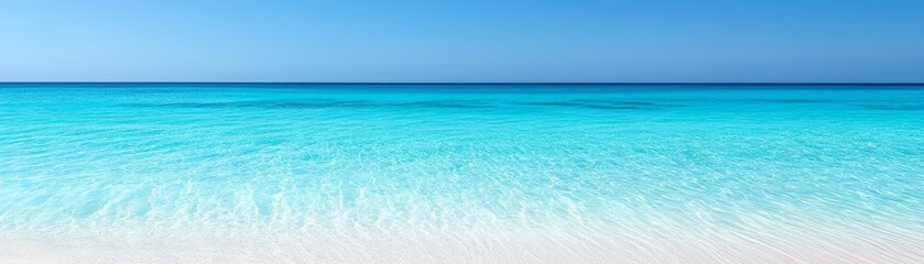 Obraz premium Pristine white sand beach meeting crystalclear turquoise water on a sunny day inviting