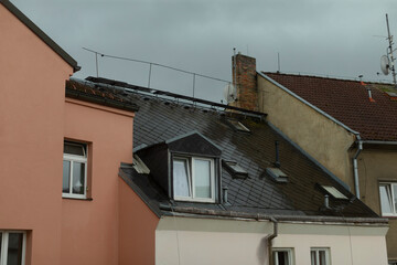 This is a structure that features a roof, which also includes a window situated on top, allowing light and air to enter
