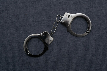 Police handcuffs on the USA flag, close-up