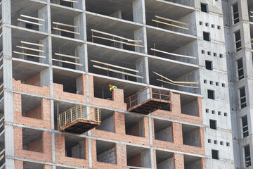 Silhouette Workers under Building Construction