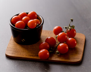 Close-Up of Cherry Tomatoes on a Wooden Board
