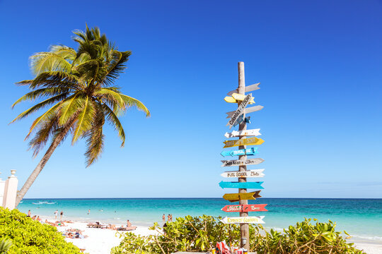 Naklejki Directions signpost on the beach, Tulum, Mexico