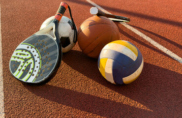 Set of sport equipment, rackets and tennis balls soccer and basketball balls