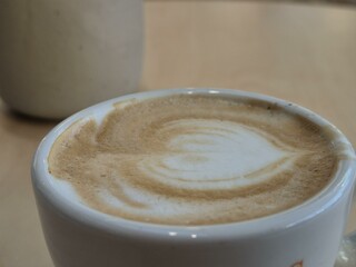 Cup of coffee close view background, breakfast with coffee