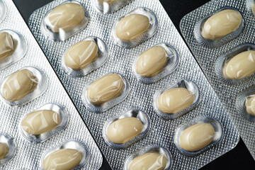 Oil filled blister pack white softgel capsules of food supplements, fish oil, omega 3, vitamin DHA