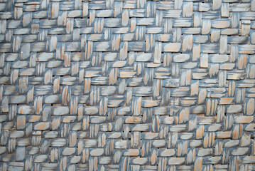 The background is made of natural bamboo with hand-woven craft work.