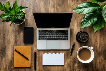 A Laptop, Coffee, and Office Supplies on a Wooden Desk