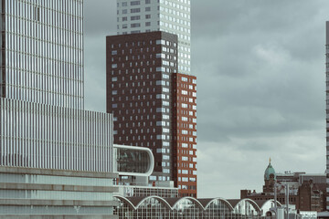City buildings combining old architectural styles with new, showing the blend of tradition and contemporary designs in a bustling urban environment in Rotterdam