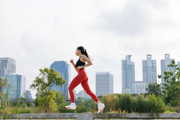 woman running jogging in park outdoor in city center