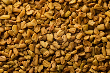 Naklejka premium Fenugreek seeds background. Top view