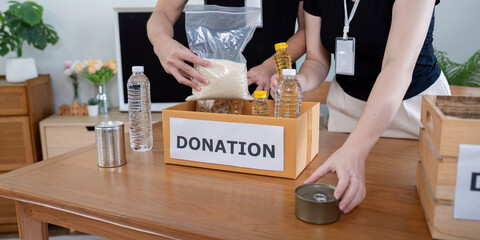 Community Volunteer Packing Food Supplies for Donation Concept of Food Security and Community Support