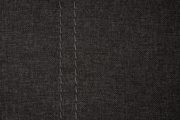 Close-up view of textured fabric with visible stitching pattern showcasing craftsmanship and detail