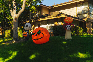 Halloween Inflatables Displayed on Suburban Lawn