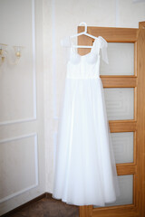 An Elegant White Dress Gracefully Hanging in a Bright and Inviting Interior Space