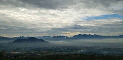 time clouds over the mountain