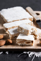 Christmas almond nougat on black slate background