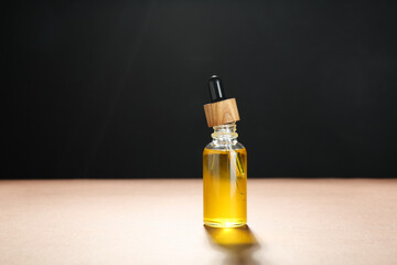 Natural tincture in bottle on color background