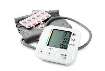 Blood pressure measuring device and pill blisters isolated on white