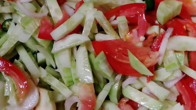 Mixed vegetables salad. Most desired food item in India, Pakistan, Greece, Turkey, Italy, Mexico, and Thailand. Healthy Organic salad made with fresh tomato, cucumber, onion, chilli, capsicum etc  