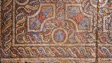 Historic Roman mosaic floor in ancient Prusa, Bursa with intricate geometric design and vivid colors