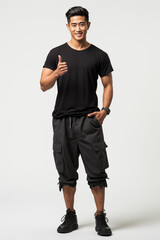 Naklejka premium A smiling man confidently posing in a casual black t-shirt and jeans