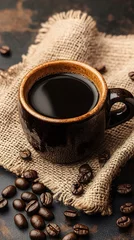 Crédence de cuisine Café et grains de café A rustic coffee setting with burlap and dark wood, featuring an old-fashioned cup of black coffee on the table, surrounded by scattered brown beans  © Kostas