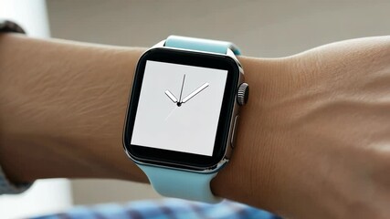 A person's wrist with a blue watch on it