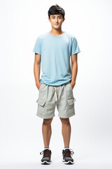 Fototapeta premium Smiling man in a light blue color casual outfit standing in a studio