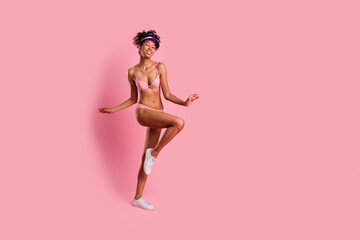 Full length photo of seductive woman underwear cap dancing enjoy self acceptance empty space isolated pink color background